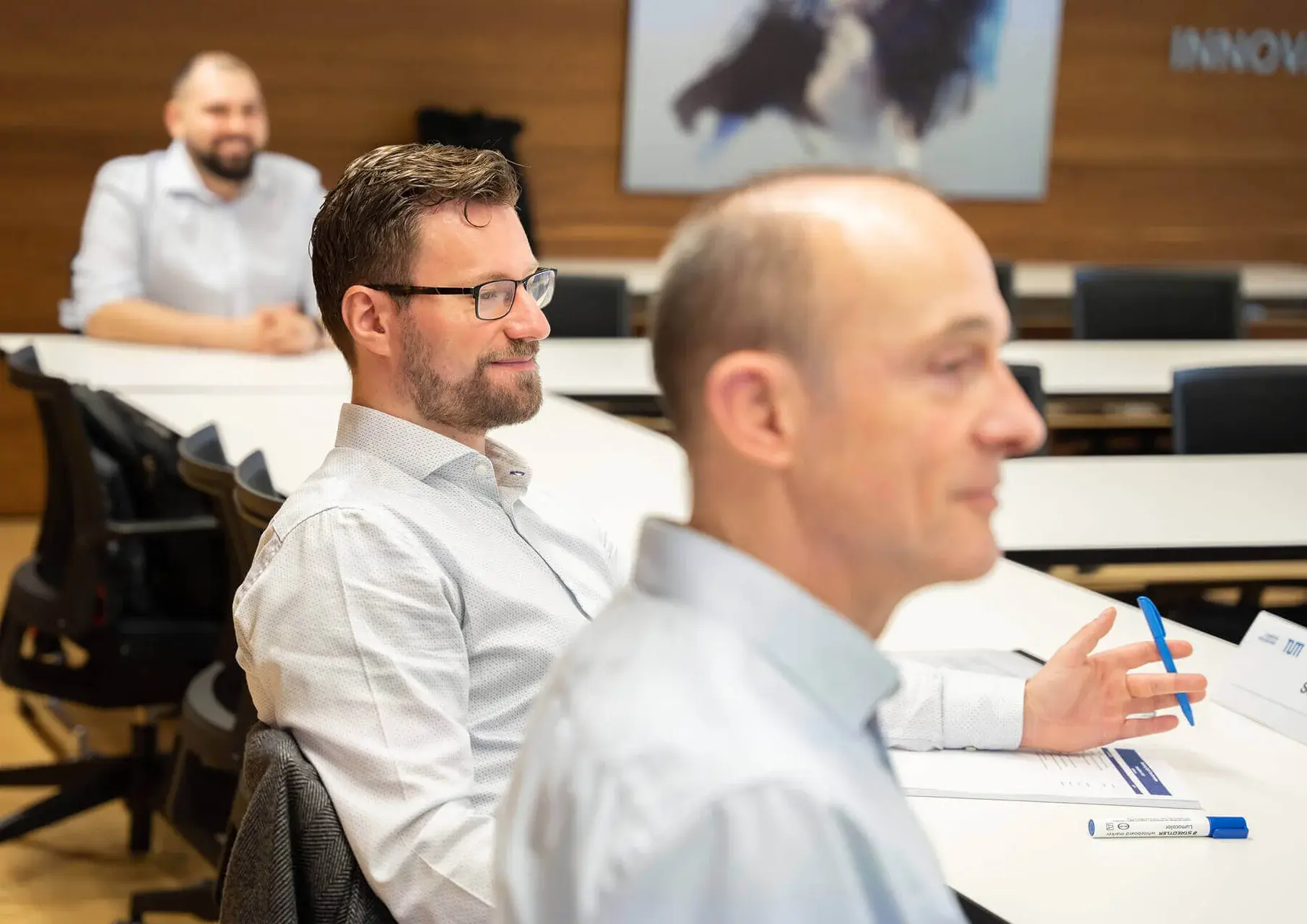 Men attending a seminar at TUM Heilbronn